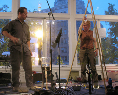 Cheryl E. Leonard accompanied by Cliff Neighbors and Felix Macnee (out of frame) at the Luggage Store Gallery, San Francisco.