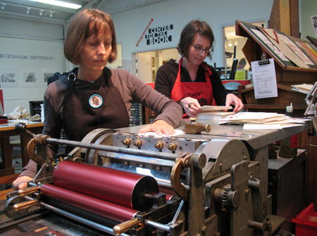 Pam DeLuco (left) and Allison Weiner at the letterpress.